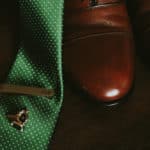 green wedding tie and leather shoes